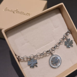 Bracciale acciaio maglia rolò con 2 quadrifogli pendenti e 1 centrale con pietre bianche