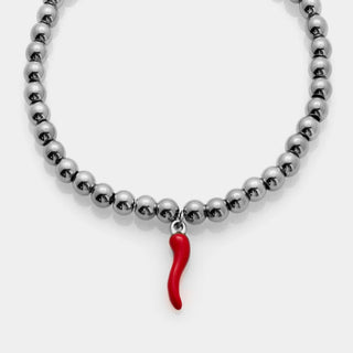 Bracciale acciaio dorato a sfere lucide e centrale pendente corno dorato