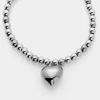 Bracciale acciaio sfere lucide con centrale cuore bombato lucido pendente