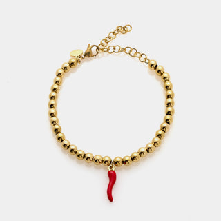 Bracciale acciaio dorato a sfere lucide e centrale pendente corno smaltato rosso
